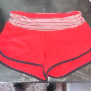 Neon pink Lululemon Speed Up running shorts